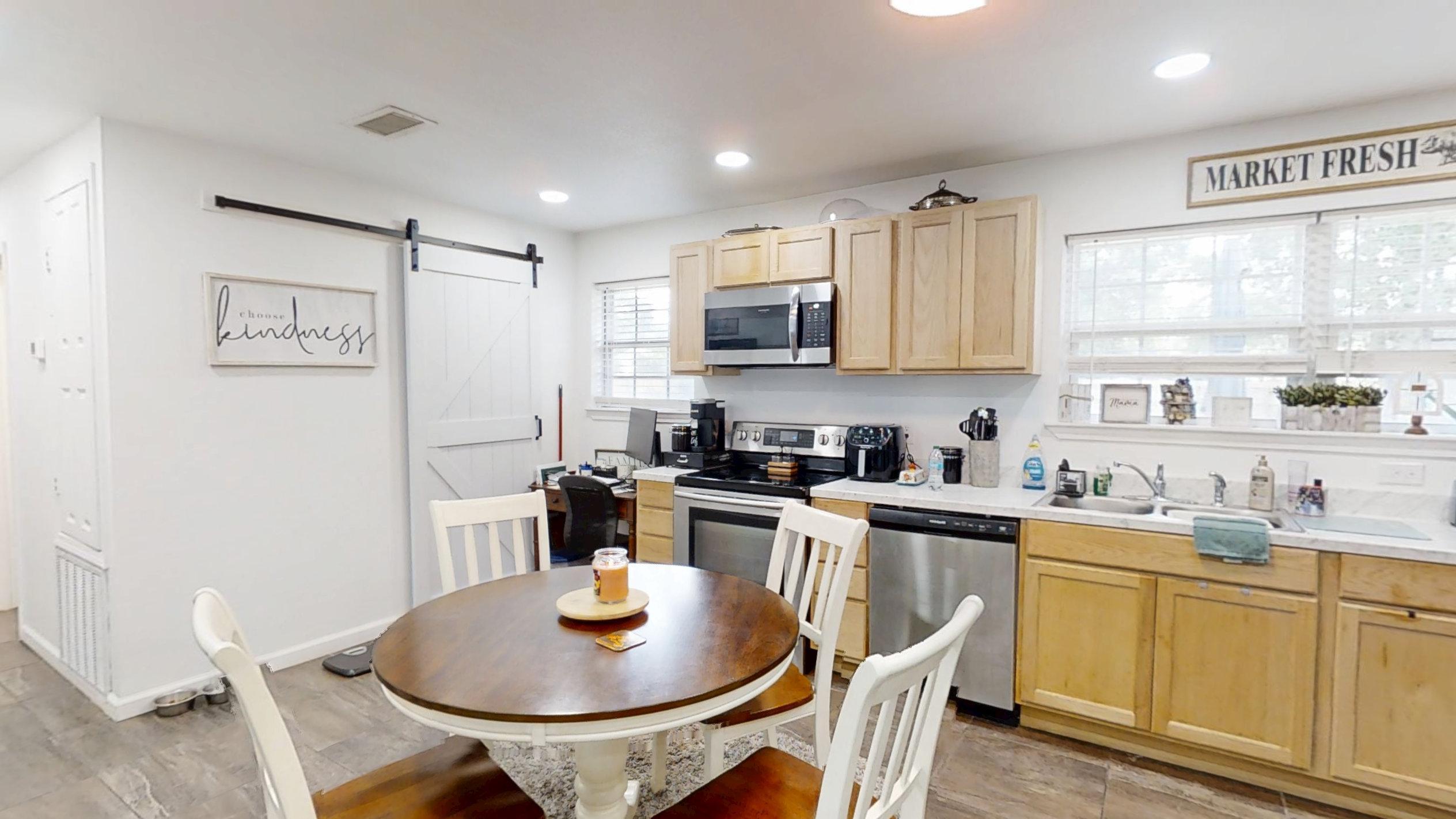 1202 Sunshine Drive Crestview, FL 32539 - Photo 19 of 38 a kitchen with a sink stove and microwave