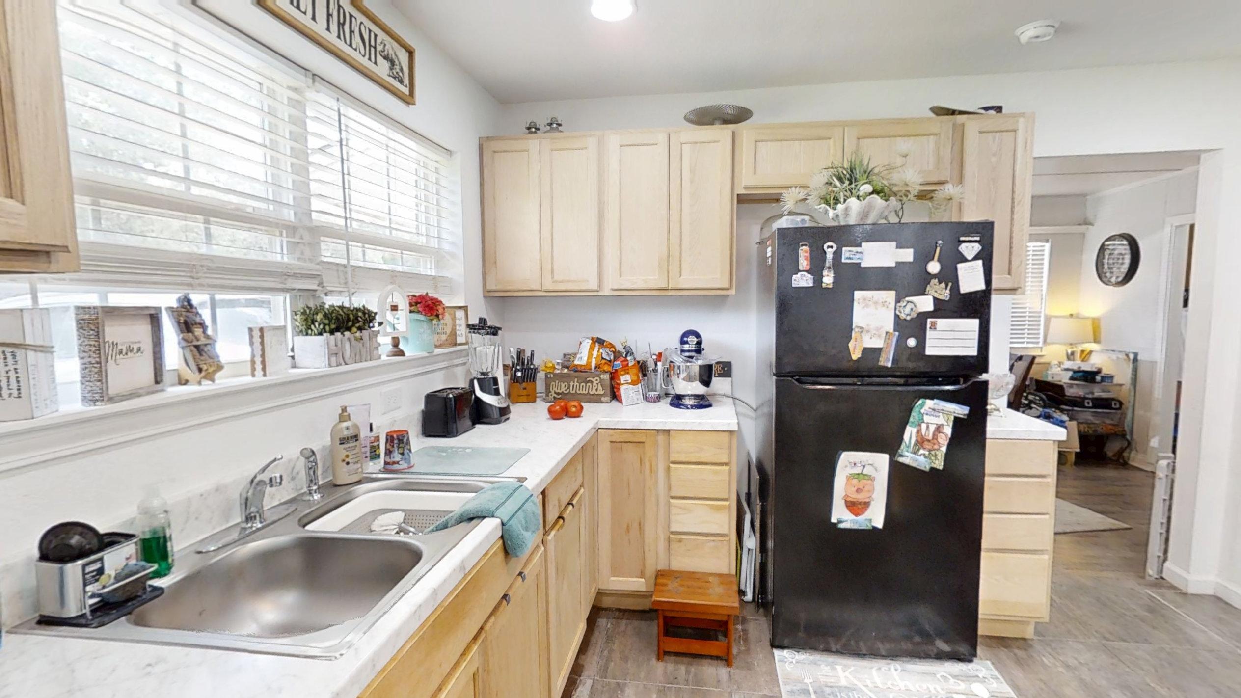 1202 Sunshine Drive Crestview, FL 32539 - Photo 21 of 38 a kitchen with a sink a stove and cabinets