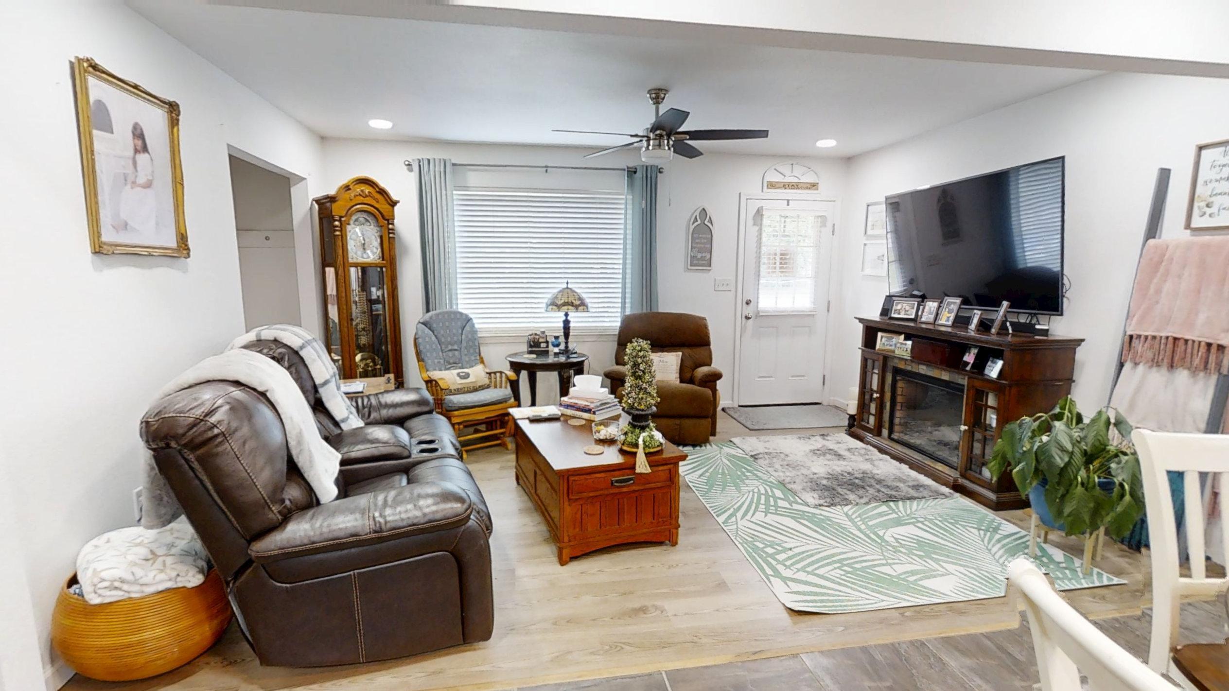 1202 Sunshine Drive Crestview, FL 32539 - Photo 22 of 38 a living room with furniture and a flat screen tv
