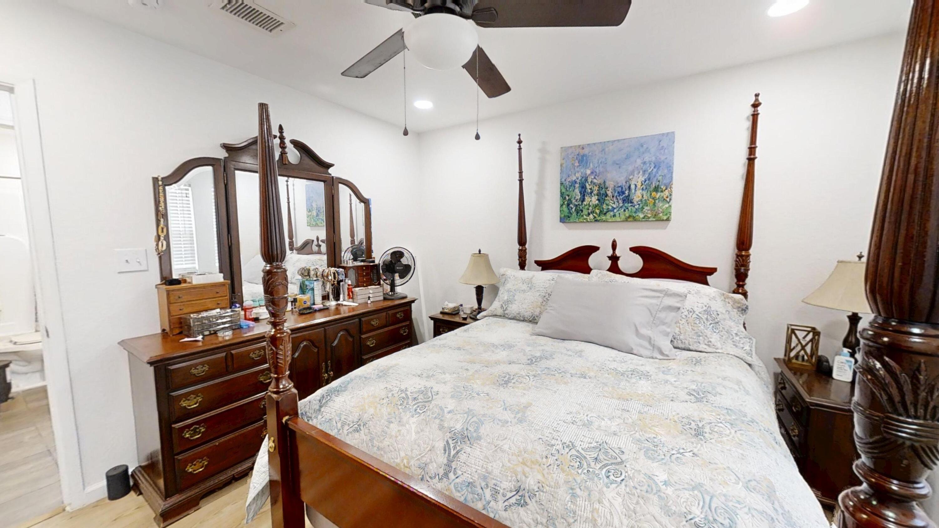 1202 Sunshine Drive Crestview, FL 32539 - Photo 36 of 38 a bedroom with a bed and a flat tv screen on a dresser