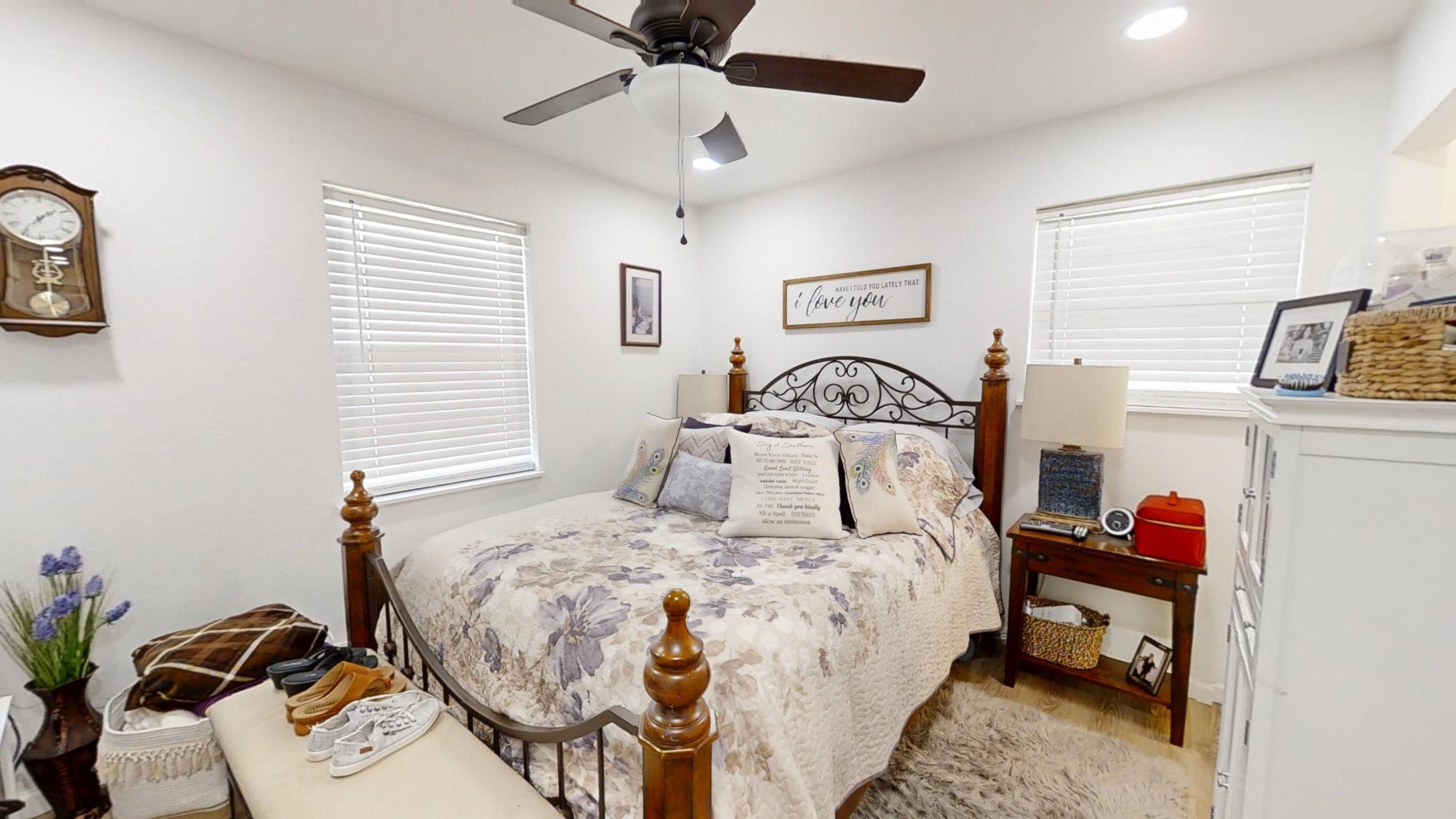 1202 Sunshine Drive Crestview, FL 32539 - Photo 37 of 38 a bedroom with a bed and a chandelier