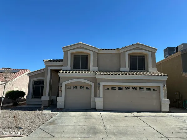 a front view of a house with a garage