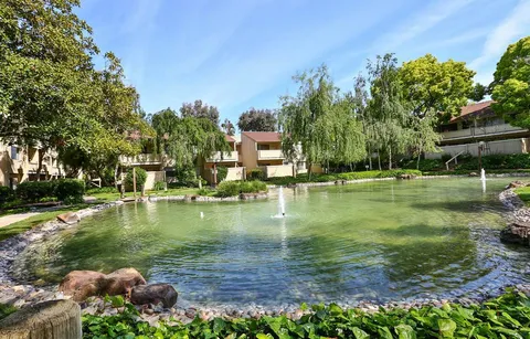 a view of a lake with a building in the background