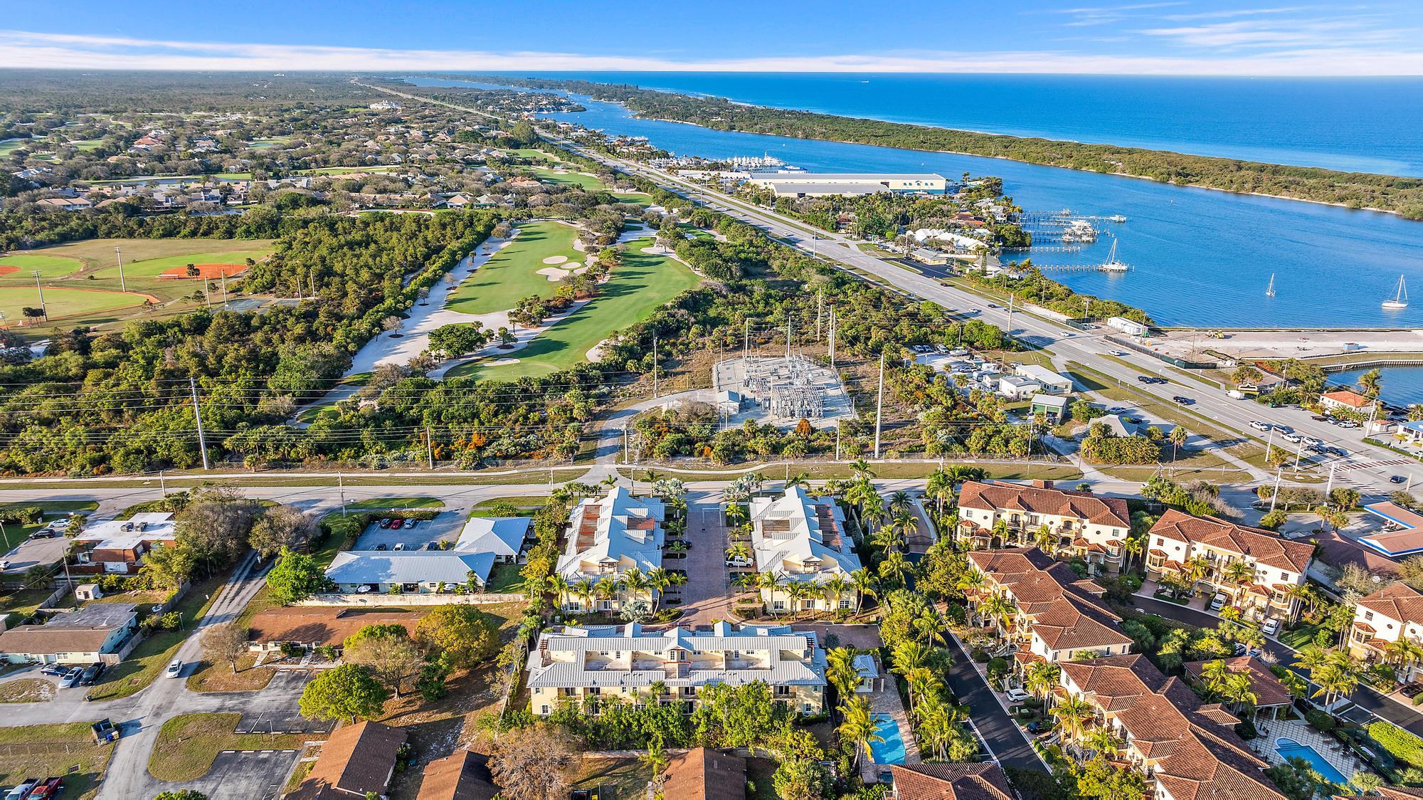 3770 County Line Road, Unit C6 Tequesta, FL 33469 - Photo 12 of 33 a view of a city with an ocean
