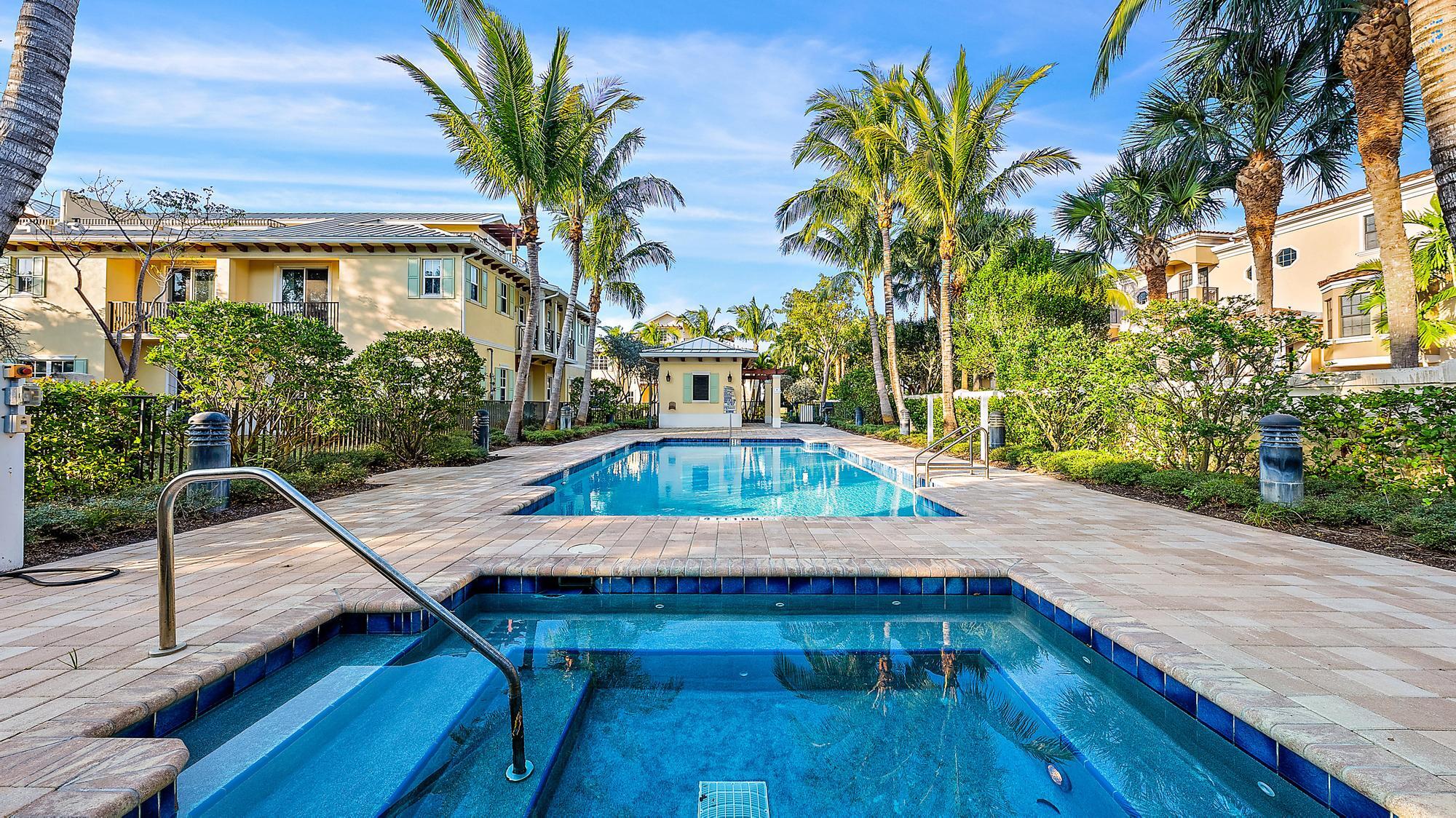 3770 County Line Road, Unit C6 Tequesta, FL 33469 - Photo 13 of 33 a view of a patio with table and chairs with wooden floor and plants