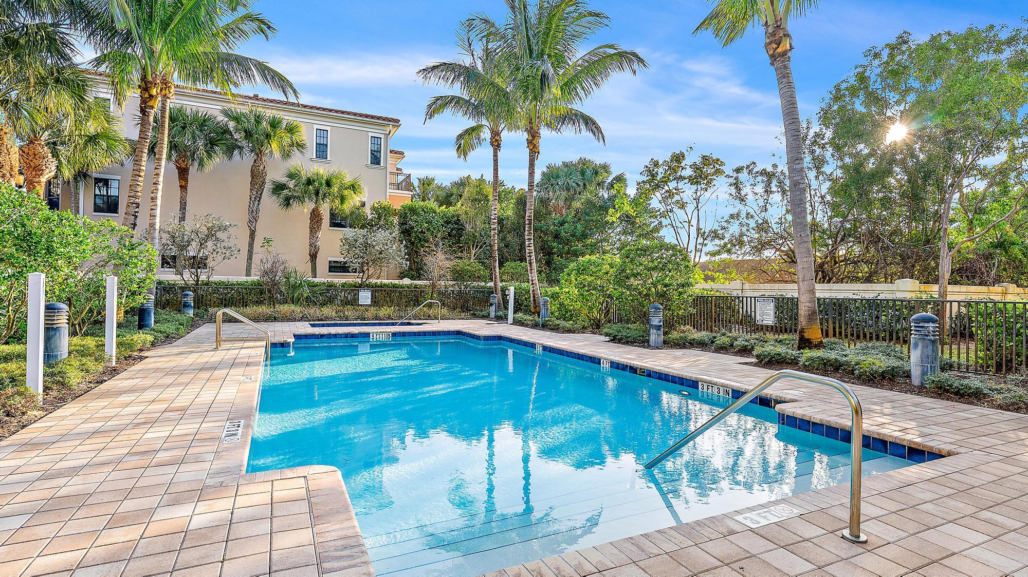 3770 County Line Road, Unit C6 Tequesta, FL 33469 - Photo 15 of 33 a swimming pool with outdoor seating and yard