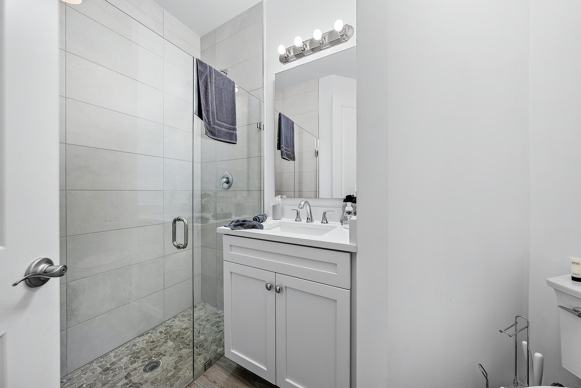 3770 County Line Road, Unit C6 Tequesta, FL 33469 - Photo 20 of 33 a bathroom with a sink a toilet and shower