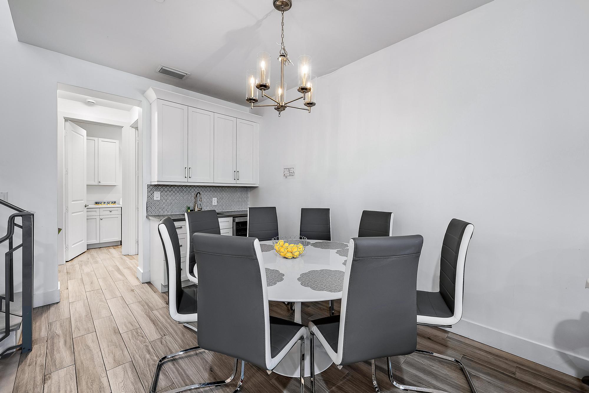 3770 County Line Road, Unit C6 Tequesta, FL 33469 - Photo 26 of 33 a view of a dining room with furniture and wooden floor