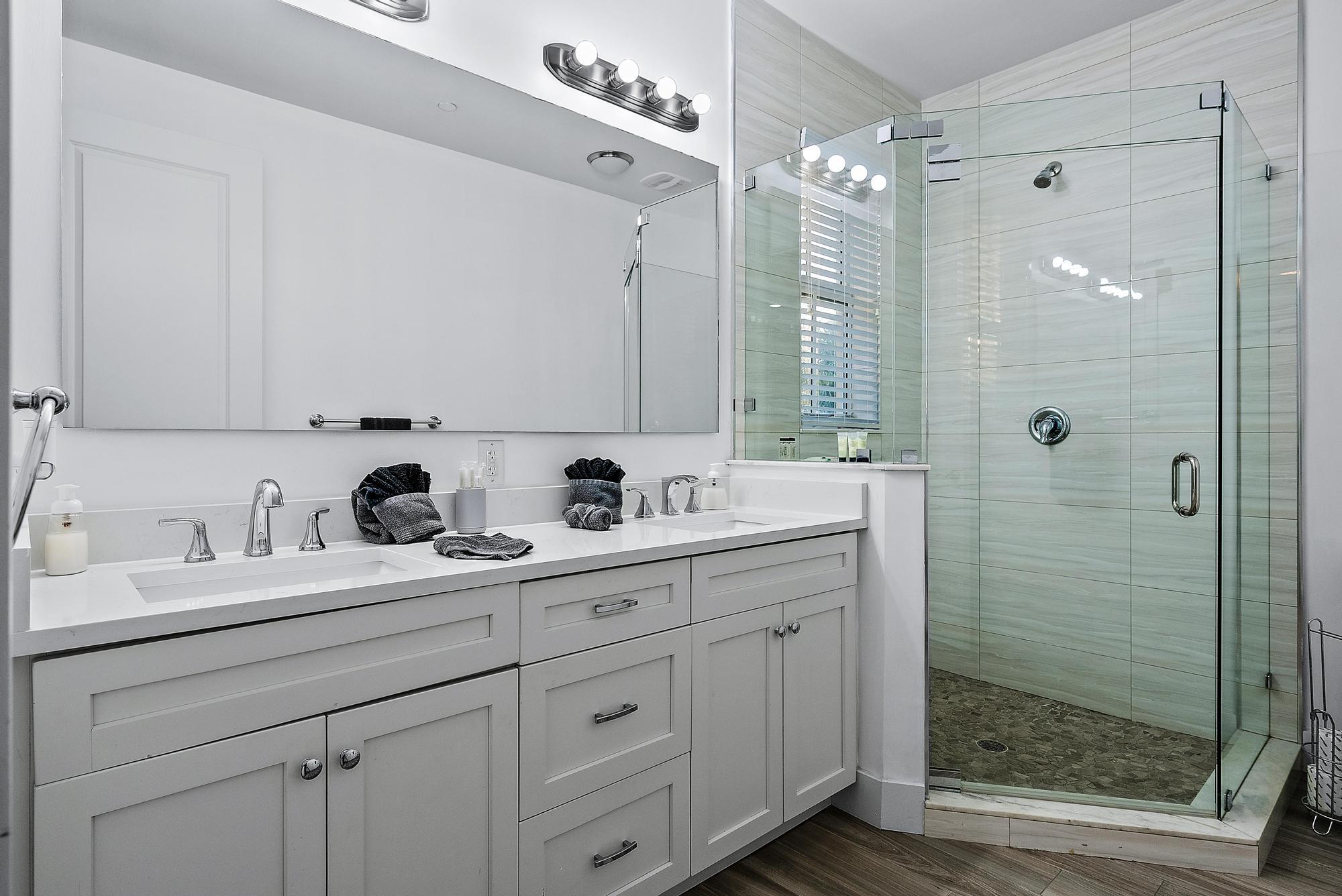 3770 County Line Road, Unit C6 Tequesta, FL 33469 - Photo 33 of 33 a bathroom with double sink and a mirror