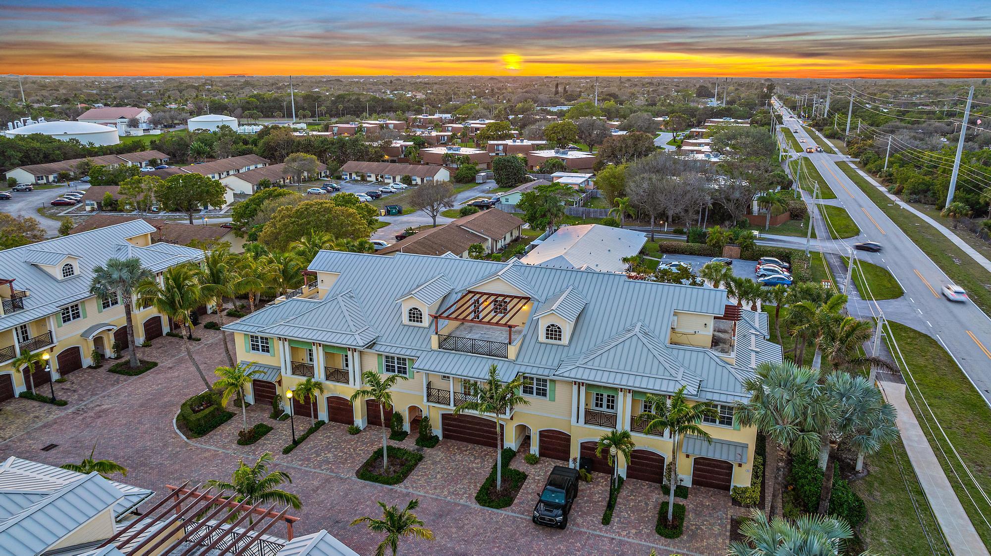 3770 County Line Road, Unit C6 Tequesta, FL 33469 - Photo 6 of 33 a view of multiple houses with yard