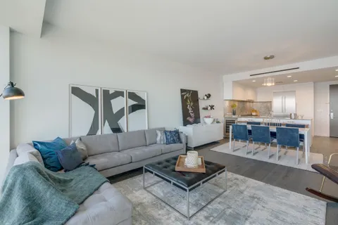 a living room with furniture and a table