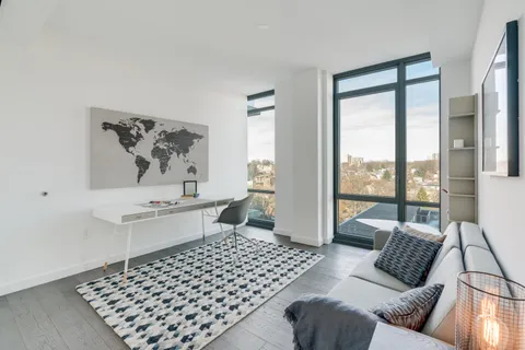 a bedroom with furniture and a window