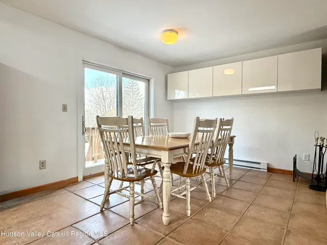 a kitchen with granite countertop a refrigerator sink stove and cabinets
