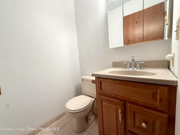 a bedroom with a bed dresser and a window