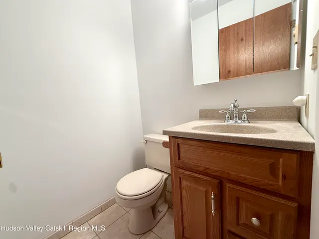 a bedroom with a bed dresser and a window