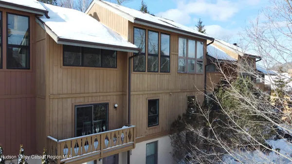 a view of a house with a window and balcony