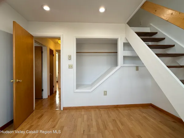 a view of a room with stairs and a window