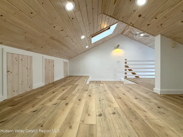 a view of a house with a flower garden