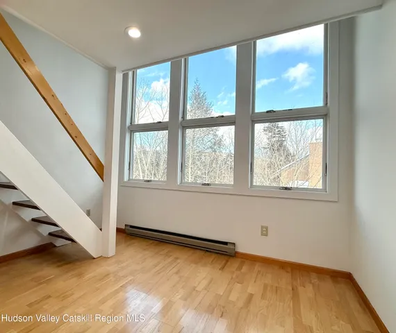 an aerial view of a backyard with chairs