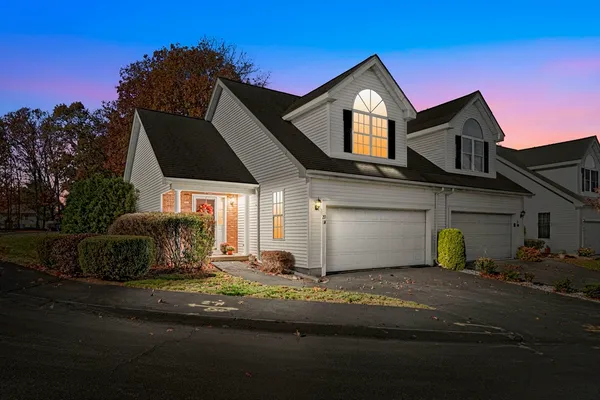 a front view of a house with garage