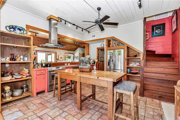 a bed room with a bed and a large window