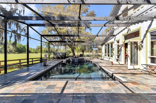 a view of a room with wooden floor and staircase