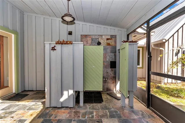 a kitchen with stainless steel appliances kitchen island granite countertop a refrigerator and stove