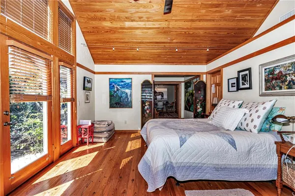 a bedroom with bed and window