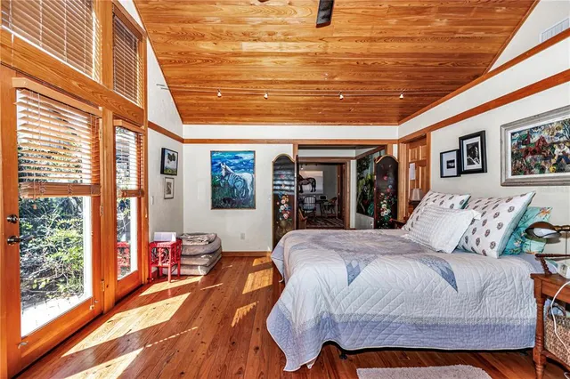 a bedroom with bed and window