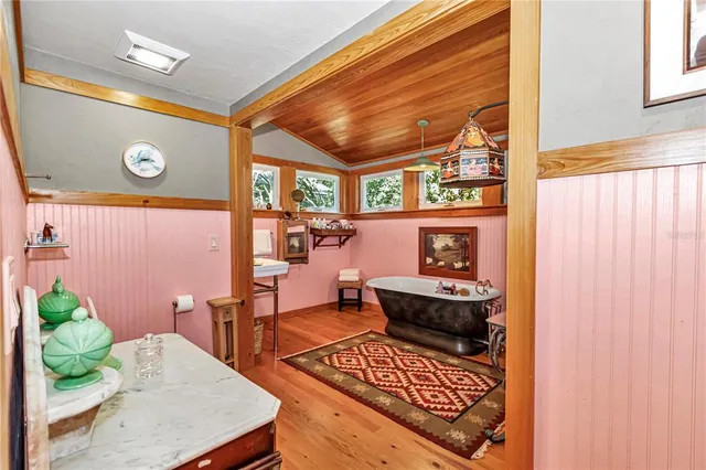 a view of room with furniture and wooden floor