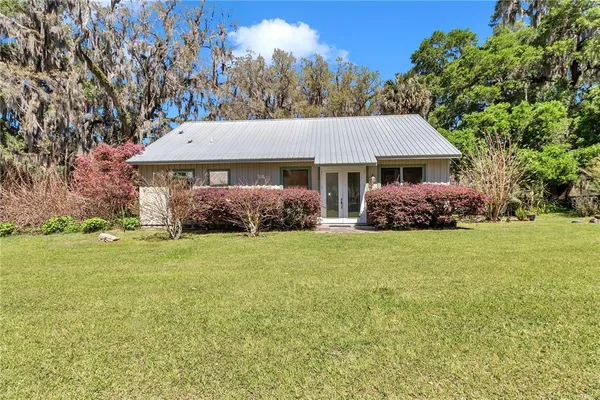 a house with trees in front of it