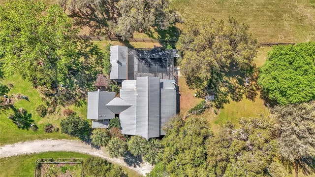 a view of a workspace with furniture window and wooden floor