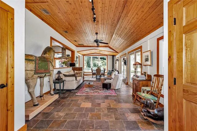 a living room with furniture fireplace and a table