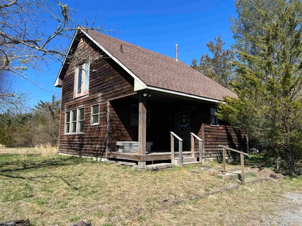 a view of house with backyard porch and furniture
