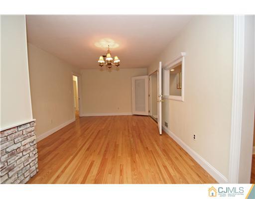 9 Greenwich Road Edison, NJ 08820 - Photo 8 of 25 a view of empty room with wooden floor
