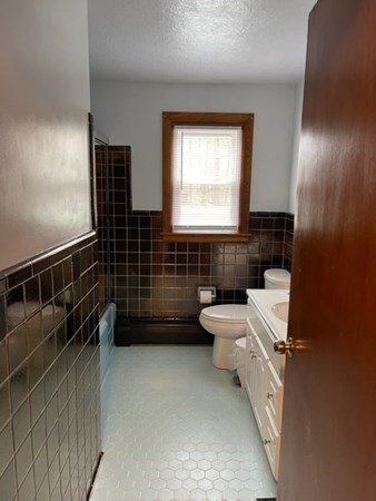5 Kitchener Road Sterling, MA 01564 - Photo 15 of 29 a bathroom with a toilet a sink and mirror