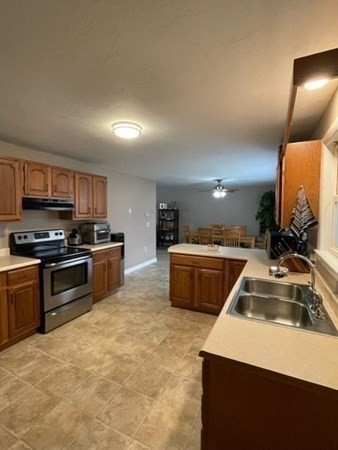5 Kitchener Road Sterling, MA 01564 - Photo 20 of 29 a kitchen with stainless steel appliances a sink a stove a microwave a sink a refrigerator and dishwasher