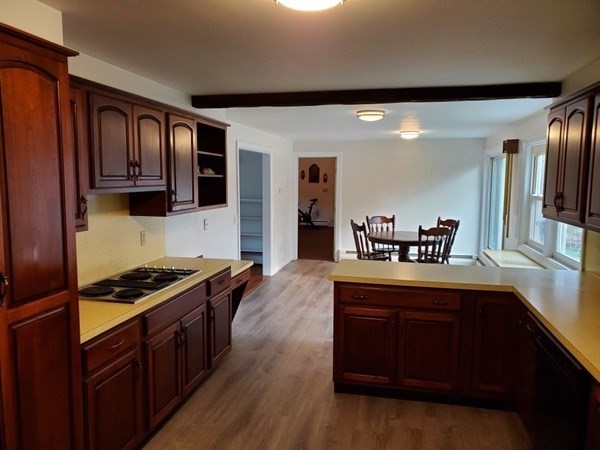 5 Kitchener Road Sterling, MA 01564 - Photo 4 of 29 a kitchen with granite countertop stove and cabinets