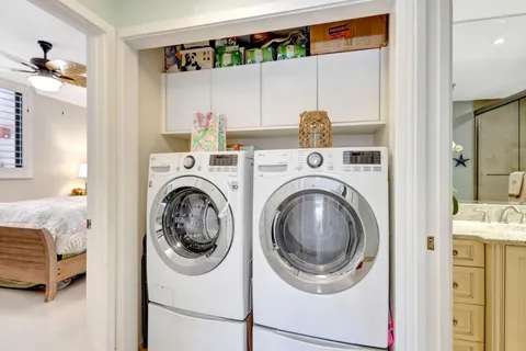 a spacious bedroom with a bed and large windows