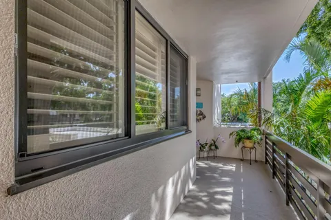 a vase of flowers sitting on a table field