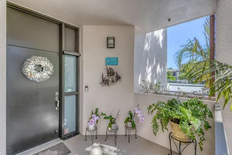 a view of a hallway with paintings on the wall