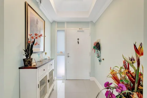 a bathroom with a sink mirror and vanity