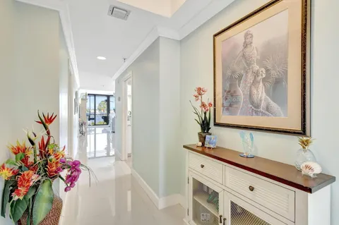 a kitchen with stainless steel appliances granite countertop white cabinets a sink and a stove