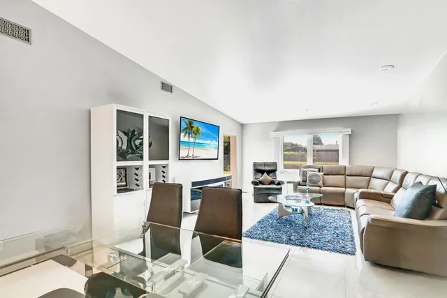 a workspace with furniture and kitchen view