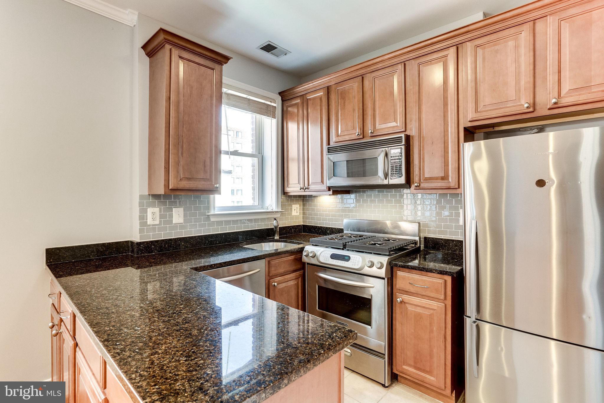 1438 Columbia Road Northwest, Unit 404 Washington, DC 20009 - Photo 8 of 19 Stainless Steel appliances & Granite