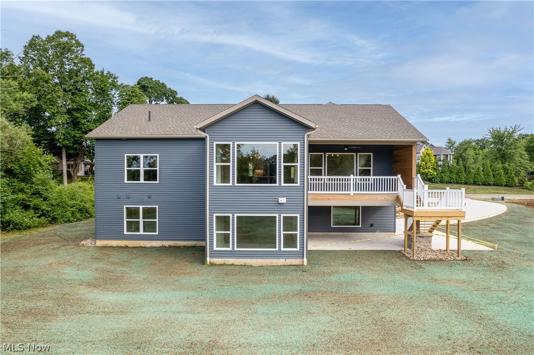 5796 Springlake Road Northwest Canton, OH 44718 - Photo 6 of 50 Back of house featuring a patio area, deck and massive windows