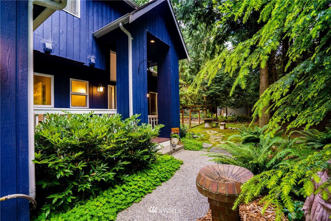 1230 Cedar Circle Langley, WA 98260 - Photo 2 of 39 a view of a house with a small yard plants and large tree