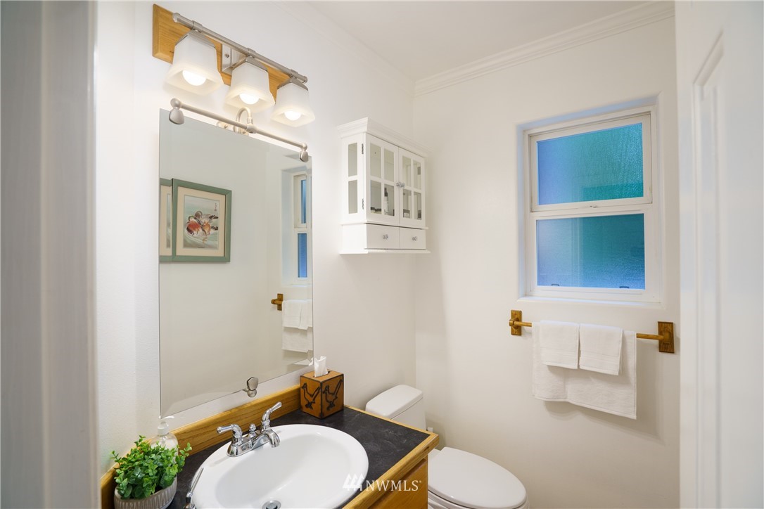 1230 Cedar Circle Langley, WA 98260 - Photo 12 of 39 a bathroom with a toilet sink and mirror