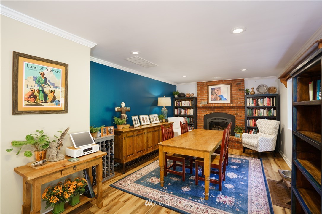 1230 Cedar Circle Langley, WA 98260 - Photo 14 of 39 a living room with furniture a fireplace and a flat screen tv