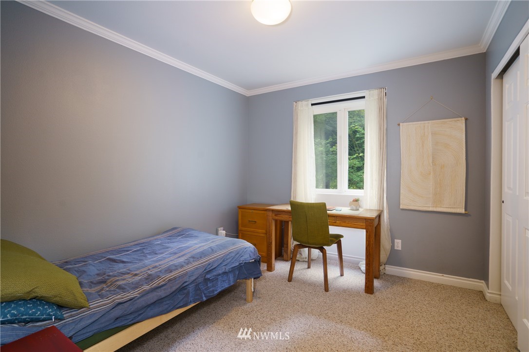 1230 Cedar Circle Langley, WA 98260 - Photo 18 of 39 a bedroom with a bed and a table chair